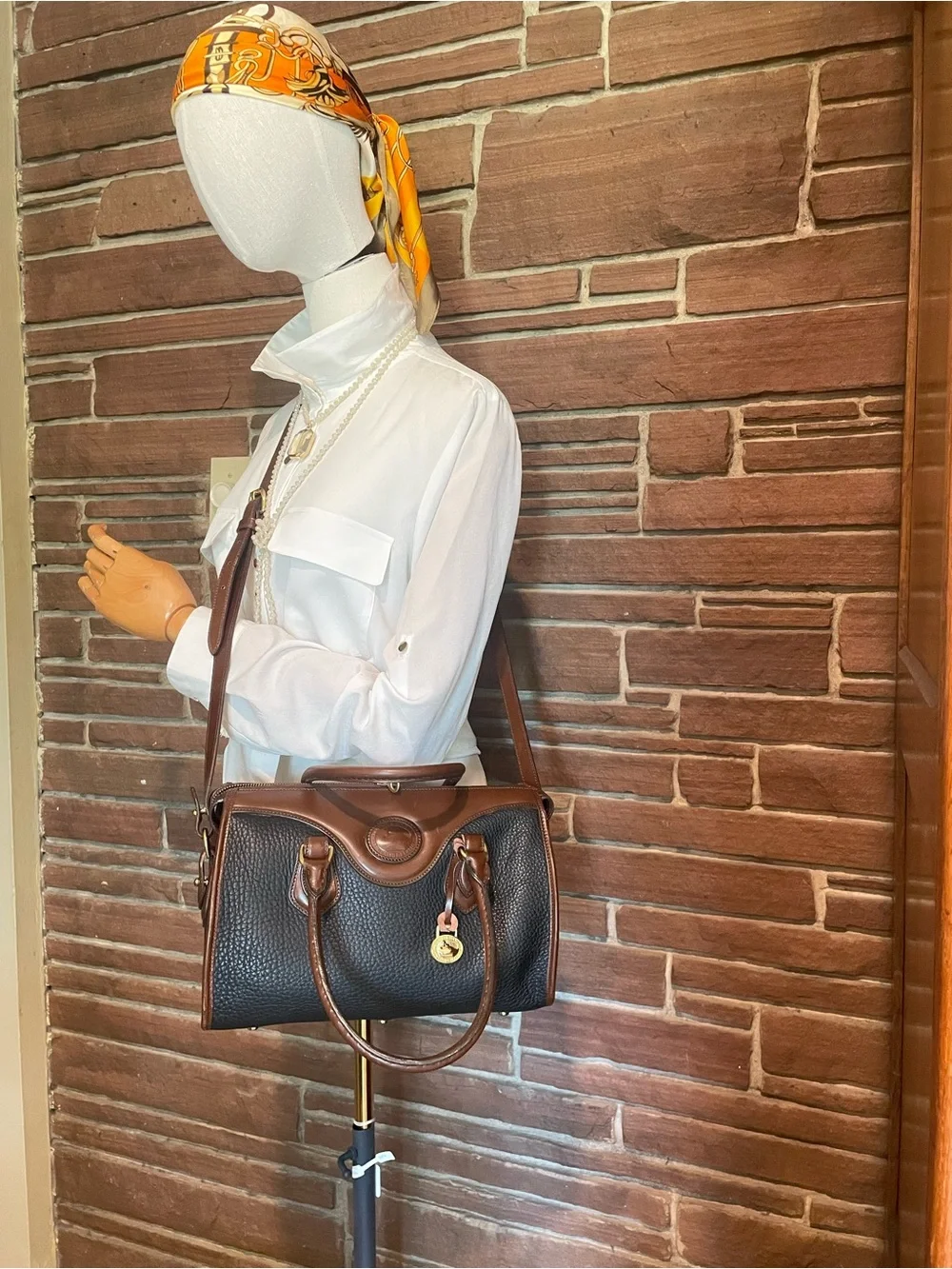 Dooney & Bourke vintage AWL Black and Brown Pebbled Leather Satchel / crossbody
